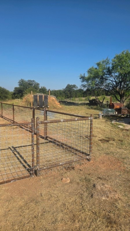 Custom pipe gate built with matching 4x4 wire panels on a Texas property