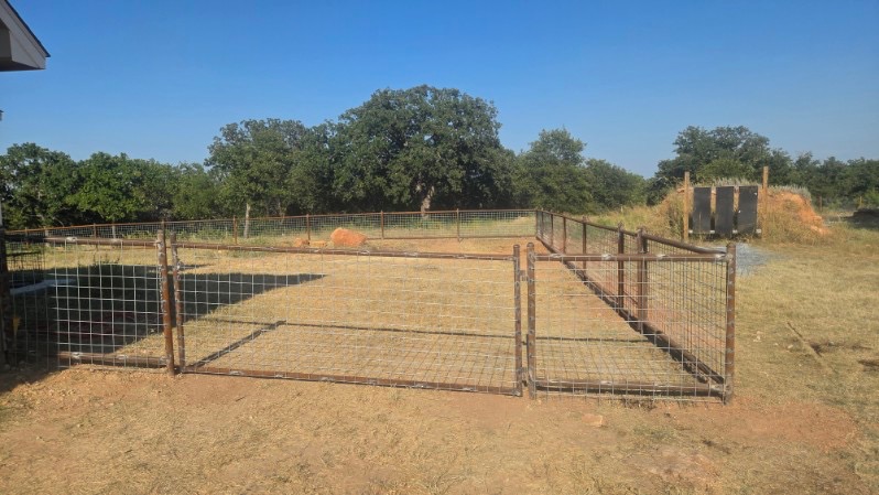Finished double gate framed in pipe with 4x4 wire panels