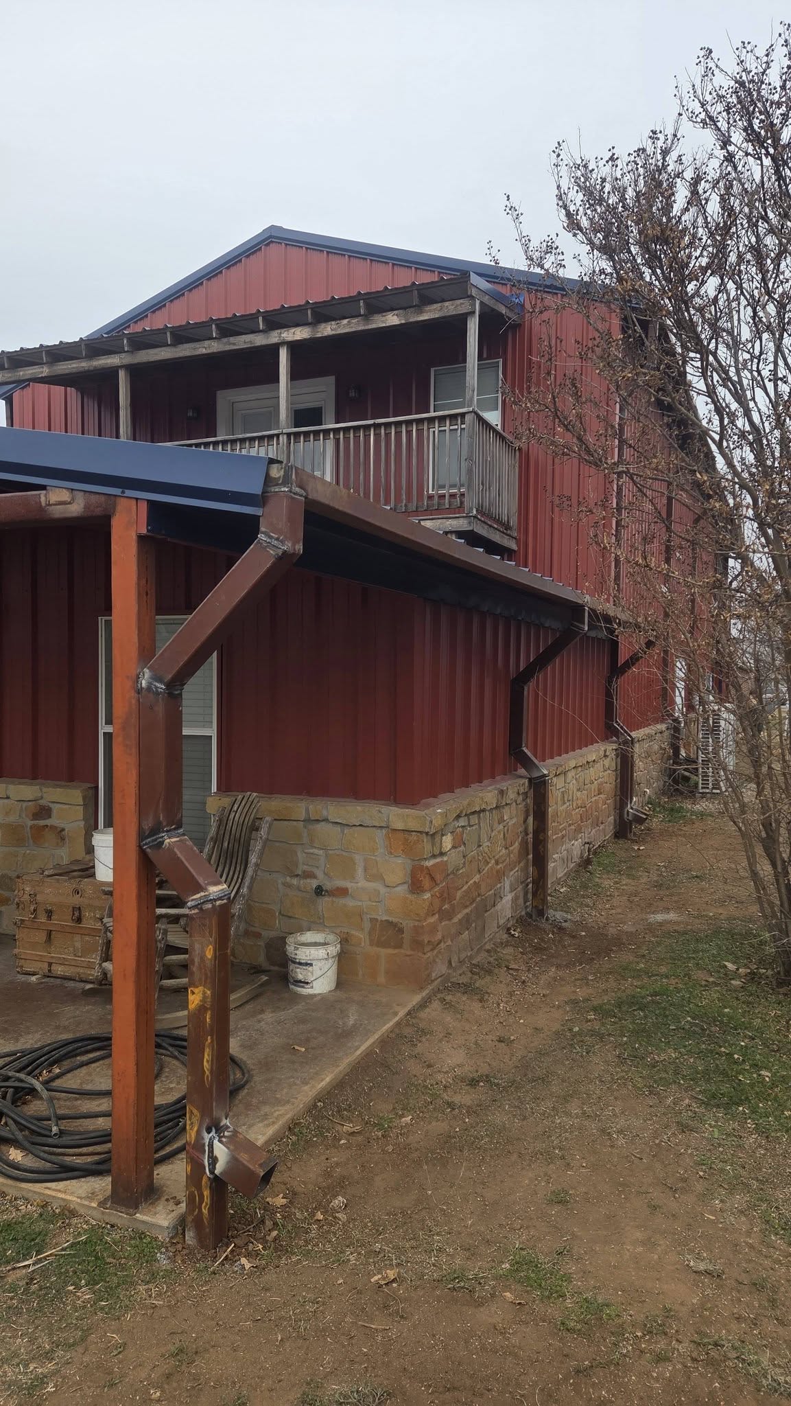 Seamless gutter and downspout work on a Texas building
