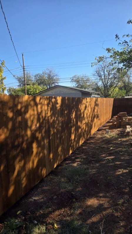 Close-up of welded steel fence-post craftsmanship on a residential fence in Texas