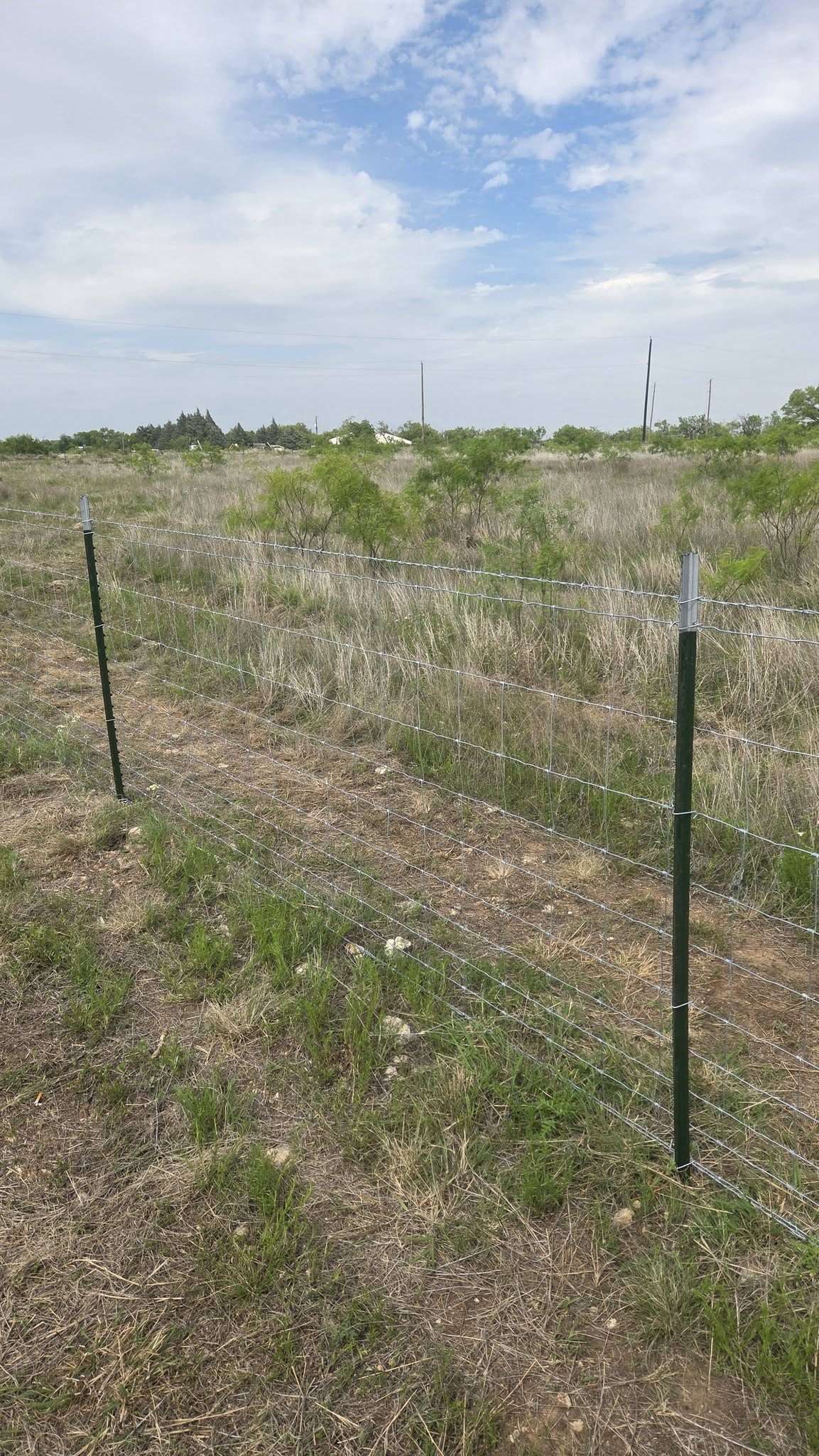 Heavy-duty welded H-brace corner on a Texas ranch fence