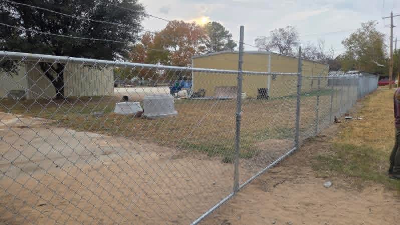 Commercial chain-link swing gate and fence installed by Lonestar Fencing & Welding in Texas