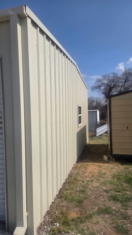 Finished metal garage wall with matching trim and utility window in Texas